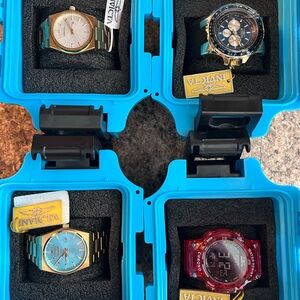 Invicta Watch Collection with Gold, Blue, and Red Accents